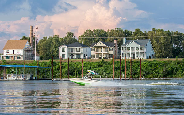 Boat in Arkansas River in front of Rockwater Village residences